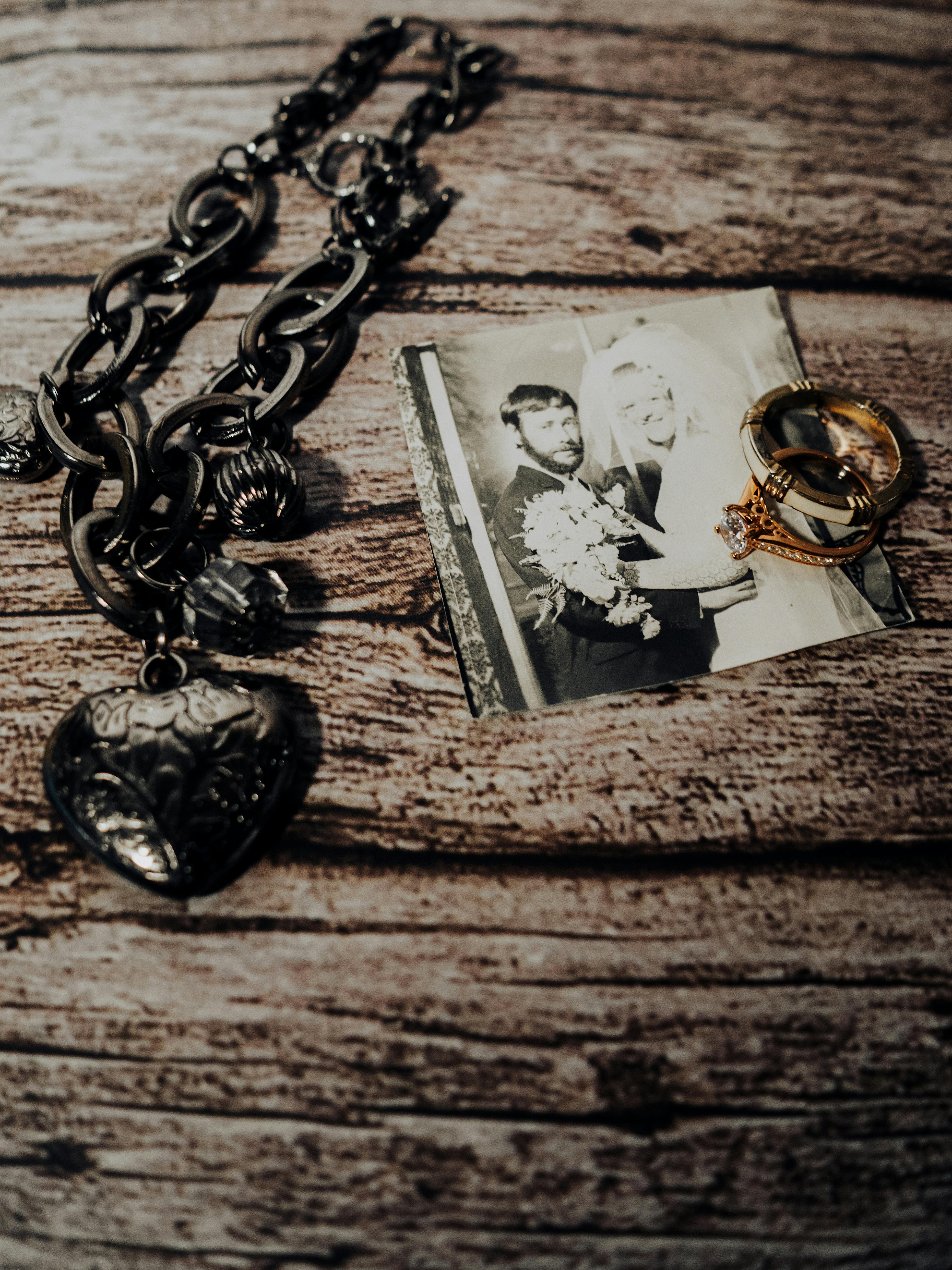 Family heirlooms: a charm bracelet, wedding photograph and rings