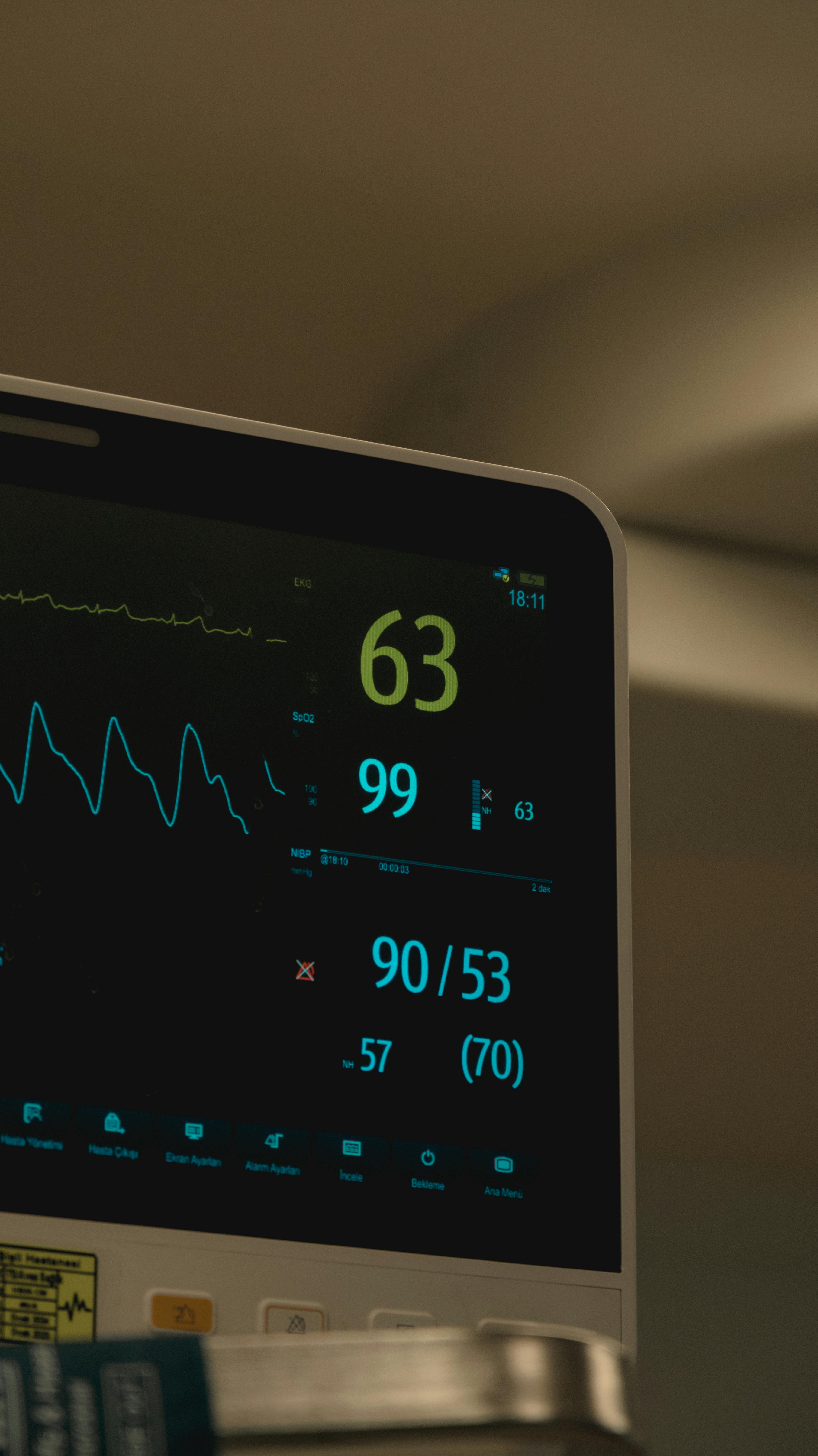 A hospital patient monitor displaying vital signs